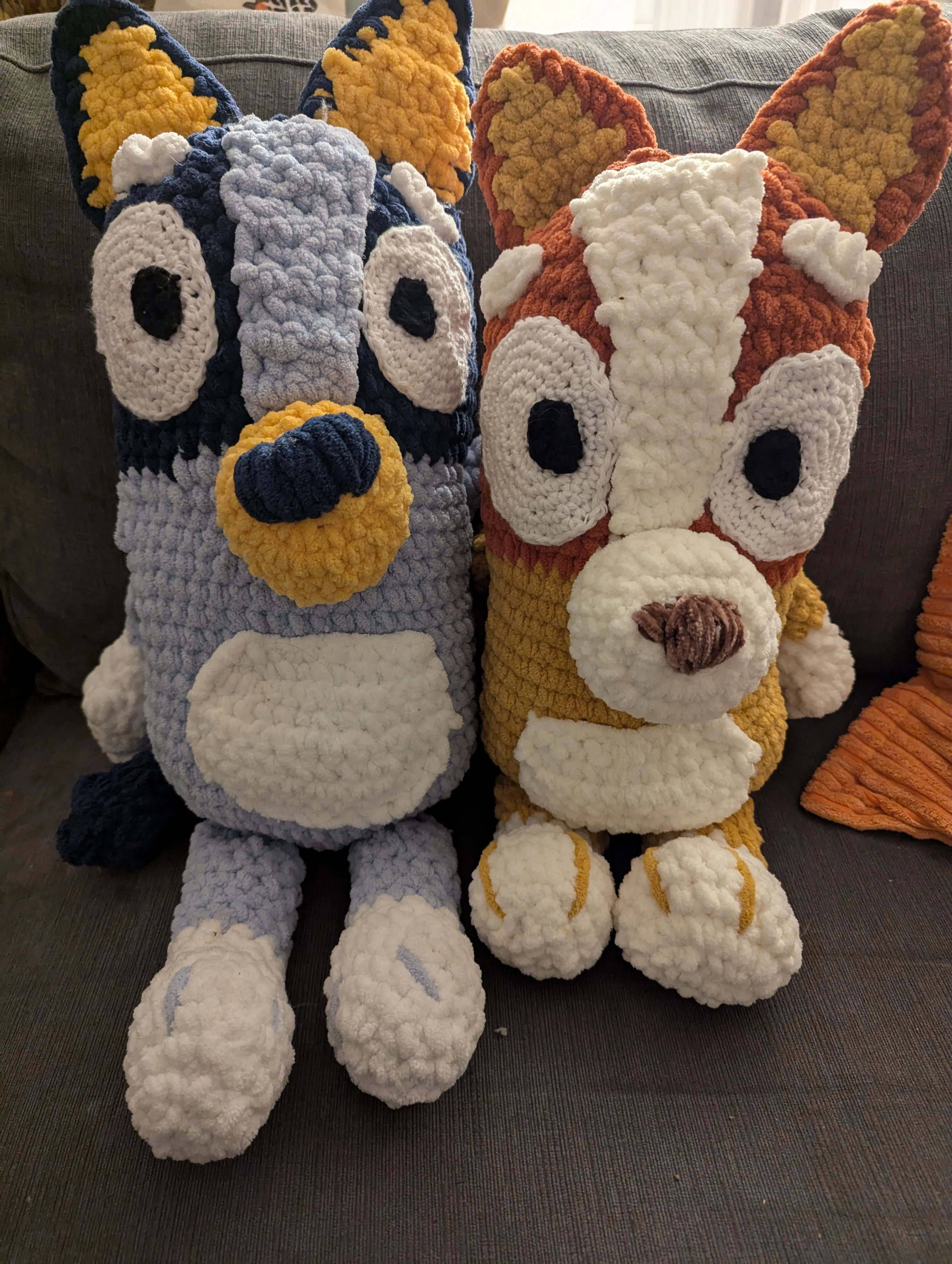 Crocheted Bluey and Bingo stuffies from the kid's show Bluey